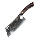The Spaceman Knives Meteor Series Kitchen Cleaver by Spaceman Knives, with a hammered stainless steel blade featuring a dimpled pattern and two holes, wooden handle, and brass rivets, rests on white marble beside black fabric. Ideal for meat chopping.