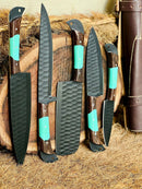 Showcased is the Texan Knives Premium Knofe Set featuring a 13" forged stainless steel blade, wenge wood and resin handle accented in teal, plus a leather sheath—handcrafted and displayed for an elevated kitchen experience.