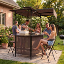 Six friends enjoy drinks and laughter under the DirectDeals Grill Gazebo with Shelves, Hooks & Double Roof Canopy, surrounded by greenery—a perfect setting for outdoor BBQs.