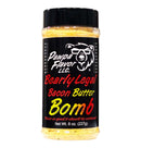 A seasoning jar labeled Pawpa Flavor LLC, featuring the product name “Pawpa Flavor Bearly Legal Bacon Butter Bomb Seasoning & Rub,” showcases a bear graphic on a black background with bold red, yellow, and white text. Ideal as a savory rub or for loaded baked potatoes, this bacon butter seasoning is available in an 8 oz (227g) jar.