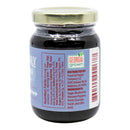 A jar of Powerful Pepper Blueberry Manzano Chili Jam with a Nutrition Facts label, ingredient list, and Georgia Grown logo. Ingredients include sugar, blueberries, Manzano chili peppers, pectin, and citric acid. Distributed by Powerful Pepper Company.