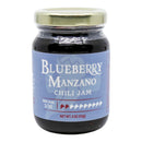 A 4 oz (113g) jar of Powerful Pepper Blueberry Manzano Chili Jam by Powerful Pepper Company, featuring a gold lid. The blue label with white and red text displays a heat level of 2 out of 10. Made with Manzano chili peppers, this blueberry jam delivers mild heat and vibrant flavor.