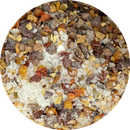 A circular close-up of B.T. Leigh’s Chipotle & Lime Finishing Salt, showing a blend of smoky chipotle, dried chili flakes, and citrus peel bits.