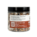 Clear plastic jar of B.T. Leigh’s Chipotle & Lime Finishing Salt with visible chili flakes and herbs, featuring a label with serving suggestions, a QR code, and distributor information.