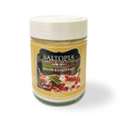 A jar from the SALTOPIA Infused Sea Salts Bacon Lovers Gift Set, labeled Bacon Ranch Salt, features images of bacon, herbs, and dip. The white-lidded jar sits on a plain background—a tasty gift for any bacon fan.
