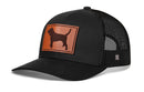 The Haka Hat Beagle Trucker Hat features a black mesh design, curved bill, and brown leather Dog Mom patch with a dog silhouette. This snapback is from Haka Hat's signature collection.