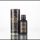 A bottle and cylindrical container of The Immaculate Beard’s Immaculate Fast Absorbing Beard Oil For Men Softens Skin, displayed on a white background—ideal for superior beard conditioning.
