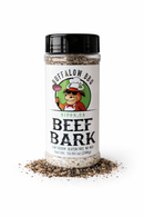 Clear plastic spice shaker of BuffalowBBQ Beef Bark BBQ Rub, featuring a label with an illustration of a cow in a chef’s hat holding a steak and the text Beef Bark.