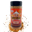 A bottle of Blazing Star BBQ’s Blazing Star Beef Rub and Seasoning, labeled “Steak, Brisket & Everything In Between,” is pictured with scattered seasoning around it and a cartoon pig chef on the label. Noted as keto-friendly and gluten-free, this bold beef rub is perfect for adding mouthwatering flavor to steaks and brisket alike.
