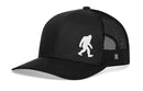 The Haka Hat Bigfoot Trucker Hat is a black mesh snapback featuring a white embroidered Sasquatch silhouette—a must-have for fans from Haka Hat.