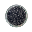 Viewed from above, a glass jar of SALTOPIA Infused Sea Salts’ Black Lava Salt sits on a white background—coarse crystals elegantly infused with activated charcoal for a dramatic finishing touch.