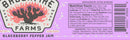 A label for Brushfire Farms Blackberry Pepper Jam featuring nutrition facts, ingredients, a barcode, and an illustrated cactus with the text Brushfire Farms, Handmade, SA TX. The purple and pink background reflects the essence of this sweet heat jam—ideal for pairing with wild game or your favorite snacks.