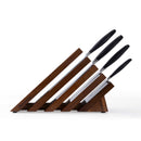 The Messermeister Blacksmith Next Level Block Set - 5 Piece features a modern wooden block and four high-carbon stainless steel knives with black handles, each in its own angled slot for easy access and style.