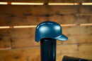 Black Baseball Batting Helmet BBQ Chimney Cap - Black mounted on a cylindrical pellet grill pipe.