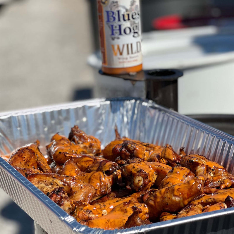 Blues Hog Wild Wing Sauce bottle with bold Cajun-style flavor, ideal for wings, meats, and seafood