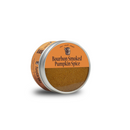 A round tin of Bourbon Barrel Foods Bourbon Smoked Pumpkin Spice, featuring a partially transparent orange label, reveals the smoky spice blend—ideal for adding unique flavor to your favorite fall recipes.