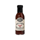 A bottle of Brownwood Farms Maple Bacon BBQ Sauce, showcasing a light-colored label adorned with decorative text and graphics, infused with the rich flavor of applewood-smoked bacon and sweet maple syrup from Brownwood Farms, set against a plain white background.