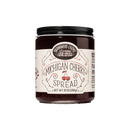A 10 oz (284 g) jar of Brownwood Farms Michigan Cherry Spread, featuring a black lid and a cream-colored label with tart cherry illustrations and text.
