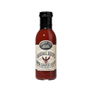 A bottle of Brownwood Farms Original Recipe BBQ Sauce with a black cap and a vintage-style label reading Brownwood Farms Original Recipe BBQ Sauce, 18 oz. The bottle contains reddish-brown sauce known for its sweet-and-tangy flavor and is set against a plain white background.