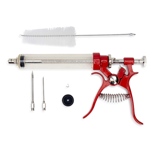 The Butcher BBQ Gourmet Pistol Grip Meat Marinade Injector by Butcher BBQ includes a clear syringe, red pistol grip handle, two metal needles, cleaning brush, black rubber stopper, and small metal pin—arranged on a white background.