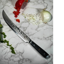 The Spaceman Knives Interstellar Butcher Scimitar Knife, featuring a striking Damascus finish, rests on a marble countertop surrounded by diced red and green bell peppers and chopped white onion.