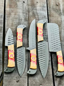 Six Texan Knives Stainless Steel 13" kitchen knives with forged blades and olivewood & epoxy handles are arranged on a rustic wooden surface, each accompanied by a leather sheath.