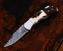 The Texan Knives Personalized Damascus Steel Pocket Knife features a patterned folding blade and wood handle—an ideal custom Valentine’s Day gift knife for your husband.