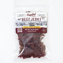 A clear plastic bag of Chiles and Smoke Sedona Sand Beef Jerky – Southwest Garlic & Chile, showcasing reddish-brown jerky pieces inside. The packaging features Natural Smoke Flavor and Ranch Cut, with a ranch scene graphic that highlights the bold Southwest flavor. This beef jerky is crafted in small batches by Chiles and Smoke for exceptional quality and taste.
