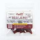 A clear bag of Chiles and Smoke Chiles & Smoke Sedona Sand Beef Jerky – Southwest Garlic & Chile with a brown and white label displays product information, weight (3.25 oz), and a QR code. This small-batch jerky features tender pieces inside the packaging, delivering bold Southwest garlic and chile flavor in every bite.