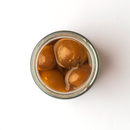 A top-down view of a glass jar filled with Taycte Famiglia Crispino Sweet Tropea Onion Antipasto—IGP Certified Italian Red Onions in brine—an authentic Italian delicacy from Taycte, placed on a white background.