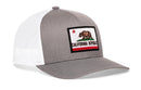 The Haka Hat California Flag Trucker Hat in gray and white features a mesh back, snapback fit, and front patch with the iconic bear, red star, and stripe—perfect for fans of classic Haka Hat style.