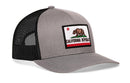 Haka Hat California Flag Trucker Hat in gray and black features a front patch with a bear, red star, and "California Republic" text. Snapback design by Haka Hat.