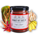A 9oz jar of Harmacy Hot Sauce Co. Chi-Chee Kimchi Sauce is displayed with fresh bok choy, garlic, ginger, and red chili peppers on a white background.