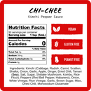 A nutrition label for Harmacy Hot Sauce Co. Chi-Chee Kimchi Sauce 9oz, a tangy kimchi hot sauce, shows zero calories per serving. Icons note it's vegan, gluten-free, and peanut-free. Ingredients and allergen info follow below.