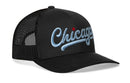 Show city pride with the Haka Hat Chicago Light Blue Script Trucker Hat—a black mesh-back Illinois snapback featuring light blue script and a red star above the "i," showcasing an iconic Haka Hat signature design.