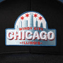 The Haka Hat Chicago Windy City Trucker Hat is a black snapback featuring an embroidered cityscape, four red stars, and “Windy City Chicago Illinois” in bold white and red letters.