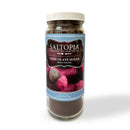 A 16oz glass jar of SALTOPIA Infused Sea Salts Chocolate Sugar: HEYO COCOA features a white lid, a blue gourmet label, and an image of chocolate-dusted truffles.