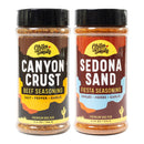 Chiles and Smoke Sonoran BBQ Seasoning Duo: two bottles of bold, southwestern-themed rubs—Canyon Crust Beef Seasoning (salt, pepper, garlic), an all-purpose beef rub inspired by Sonoran BBQ traditions, and Sedona Sand Fiesta Seasoning (chiles, herbs, garlic).