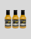 Three bottles of Gourmet Carolina Gold Classic Carolina Gold BBQ Sauce with black labels.