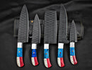 The Texan Knives Custom Hand Forged Carbon Steel Chef’s Knife Set – 5 PCS features hammered black blades and vibrant blue, red, and white handles, displayed with a black leather roll—perfect as the best anniversary gift for him.