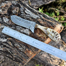 The Texan Knives Whiskey Knives Out features a 4-inch Damascus steel blade and a sheep horn handle, shown resting on a log beside a ruler for scale.