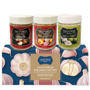 Three jars of SALTOPIA Infused Sea Salts (Garlic Salt, Garlic & Onion Salt, Lime Garlic Salt) sit atop a box with garlic illustrations, labeled "Saltopia Garlic Lovers Gift Set.