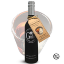 A bottle of Georgetown Olive Oil Co. Coconut-Rum White Balsamic from Modena, Italy stands in front of a glass filled with brown liquid. A tag displays the product details, and a No Alcohol symbol appears in the corner.