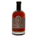 A 237 ml (8 oz) glass bottle of Under The Bark Syrup Co Coffee Maple Syrup, 100% pure, with a dark brown label featuring a maple leaf and “Made in Minnesota” text, finished with a black cap.