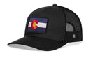 The Haka Hat Colorado Flag Trucker Hat is a black snapback with a mesh back and features a Colorado state flag patch on the front for classic comfort and style.