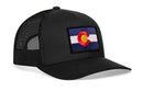 The Haka Hat Colorado Flag Trucker Hat | Black CO Snapback by Haka Hat features a black mesh design with a rectangular Colorado flag patch—blue and white stripes, red C, yellow circle—perfect for showing your Colorado pride.