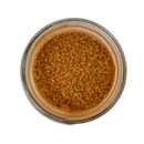 A top-down view of a glass jar filled with SALTOPIA Cinnamon Sugar: CRACKLIN' HEIGHTS 16oz evokes the rich look of specialty sugars by SALTOPIA Infused Sea Salts, perfect for baking and adding cinnamon flavor.