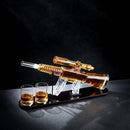 The Craftgen Rifle Whiskey Decanter Set by Craftgen, shaped like a rifle and displayed on a black stand with two whiskey glasses, stands out as unique barware against a dark background.