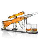 The Craftgen Rifle Whiskey Decanter Set by Craftgen features a unique decanter with an attached scope on a stand, plus two glasses, making it the perfect barware gift for any whiskey enthusiast.