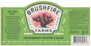 A green label for Brushfire Farms Cranberry Pepper Sauce displays a cactus illustration, holiday meal suggestions, ingredients, nutrition facts, and a barcode. This versatile condiment is ideal for adding bold flavor to your festive dishes during the holidays. The net weight is 16 oz.